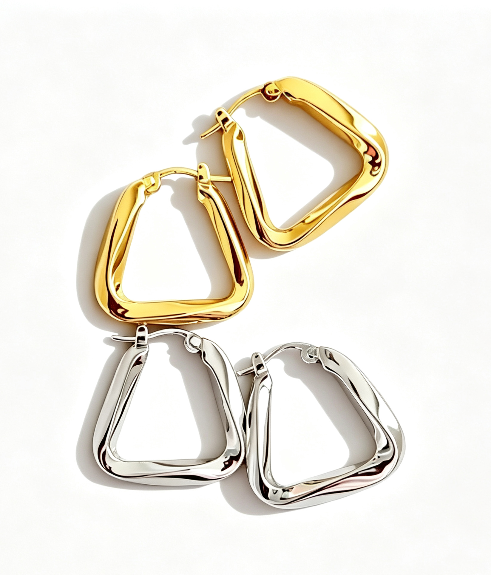 View Minimalist Twisted Triangle Hoops image 1